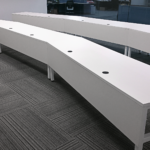 aerospace training facility desks with grommets