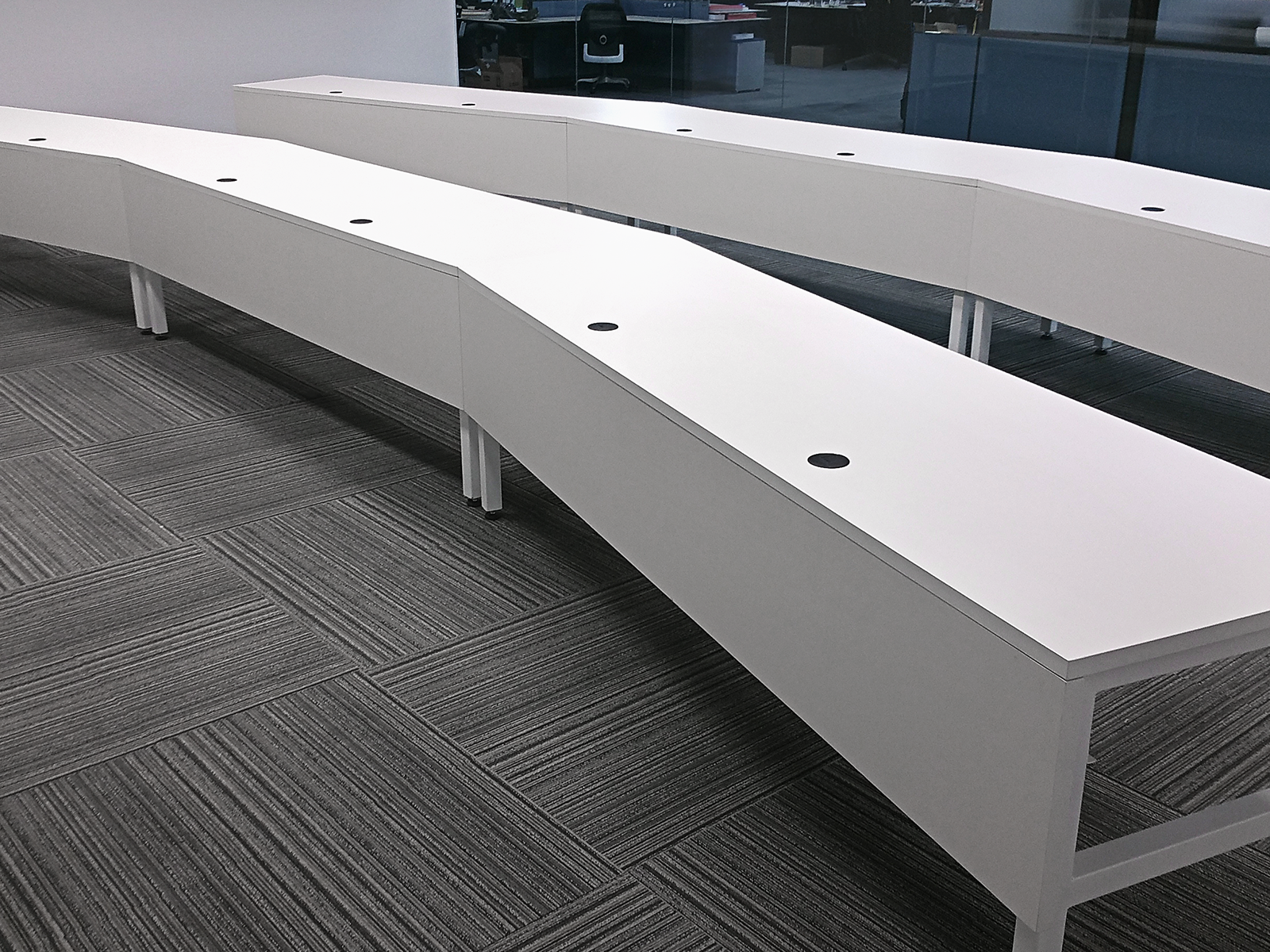 aerospace training facility desks with grommets